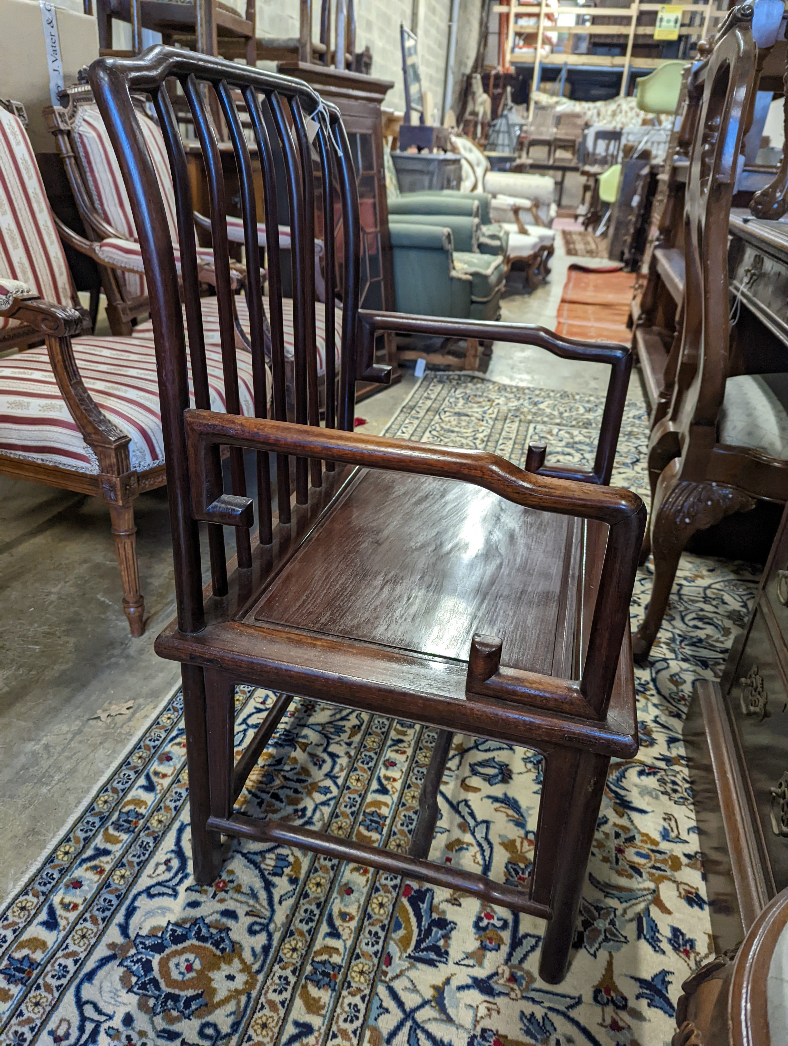 A pair of mid 20th century Chinese Hongmu elbow chairs with cushion seats, width 58cm, depth 49cm, height 92cm